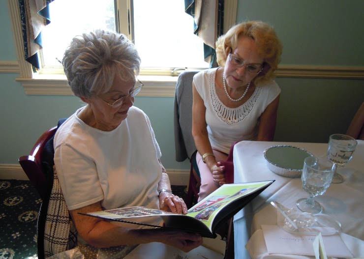 Florence and Astrid Looking at Book of Memories...10 from "O" Club Luncheon